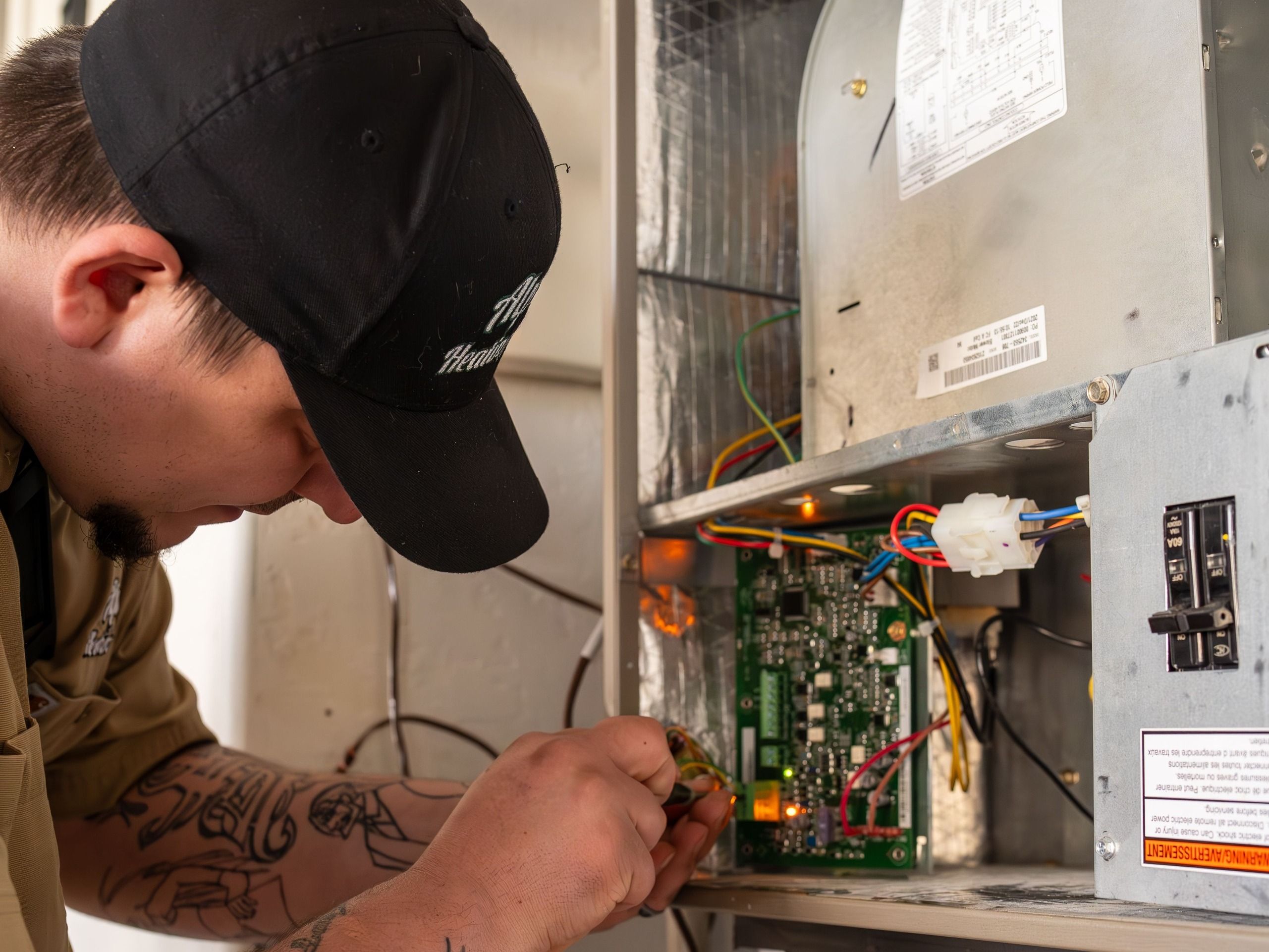 HVAC technician repairing a heat pump in a Bandon Home.