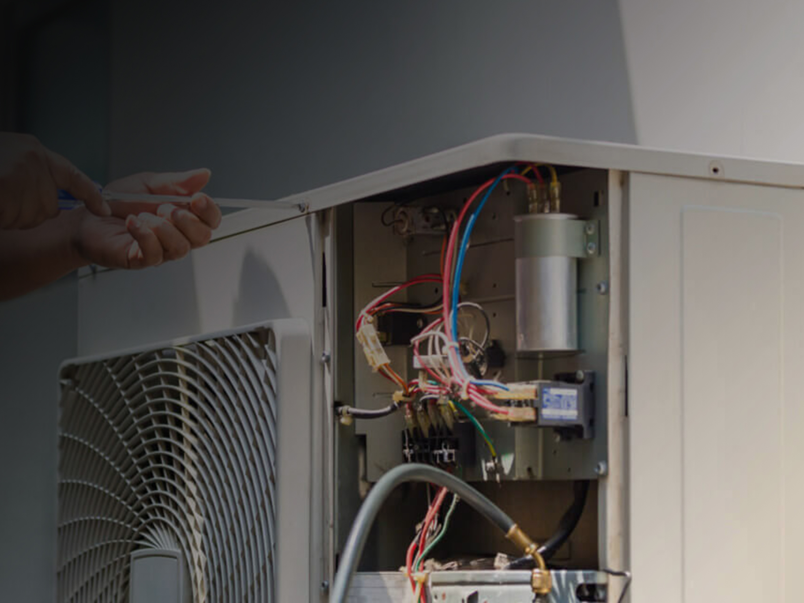 Technician repairing a furnace in a Bandon home.
