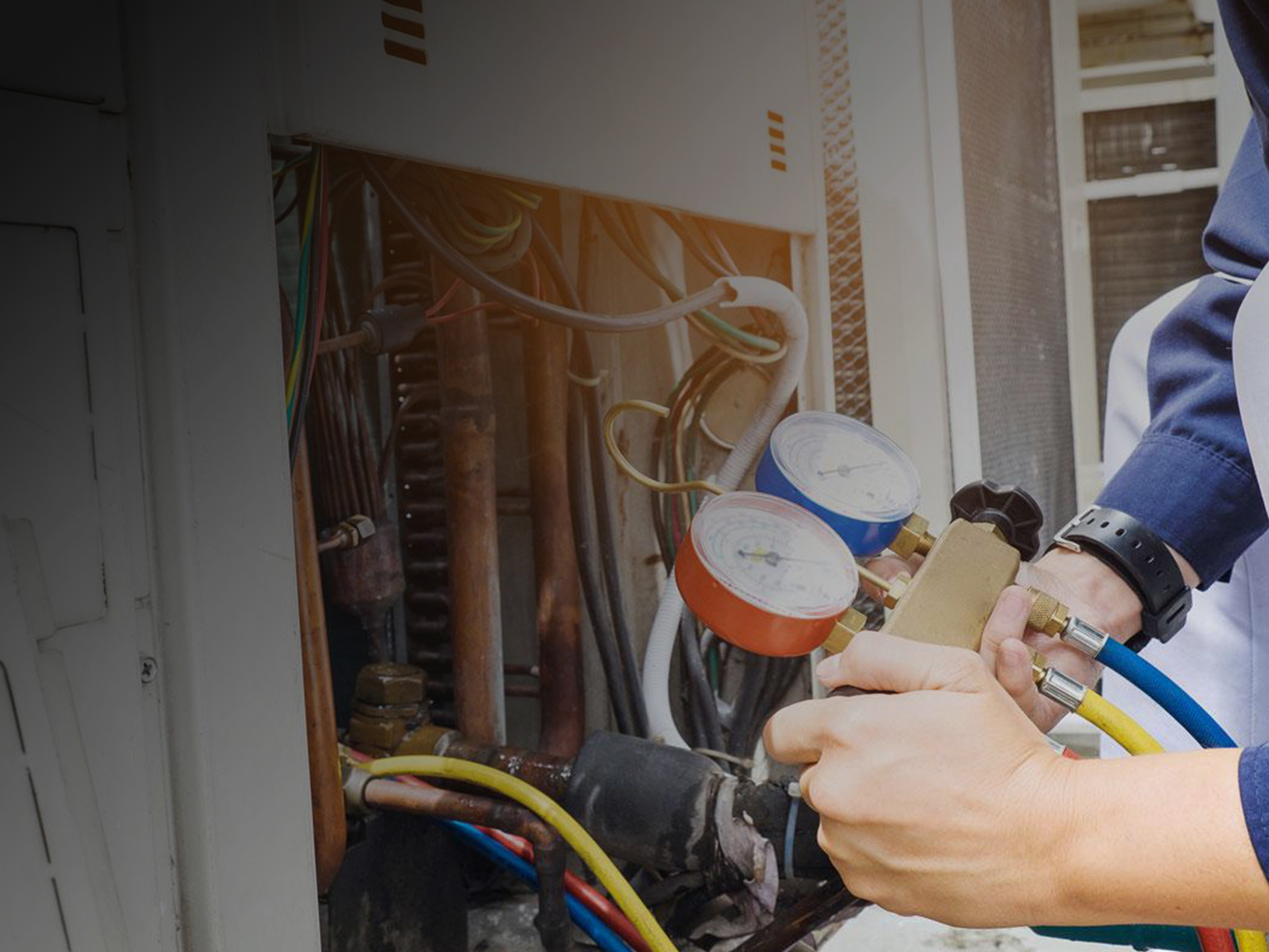Technician servicing a heating system during maintenance in Bandon