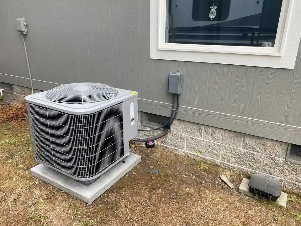 Damaged outdoor AC unit needs repair in Bandon home.