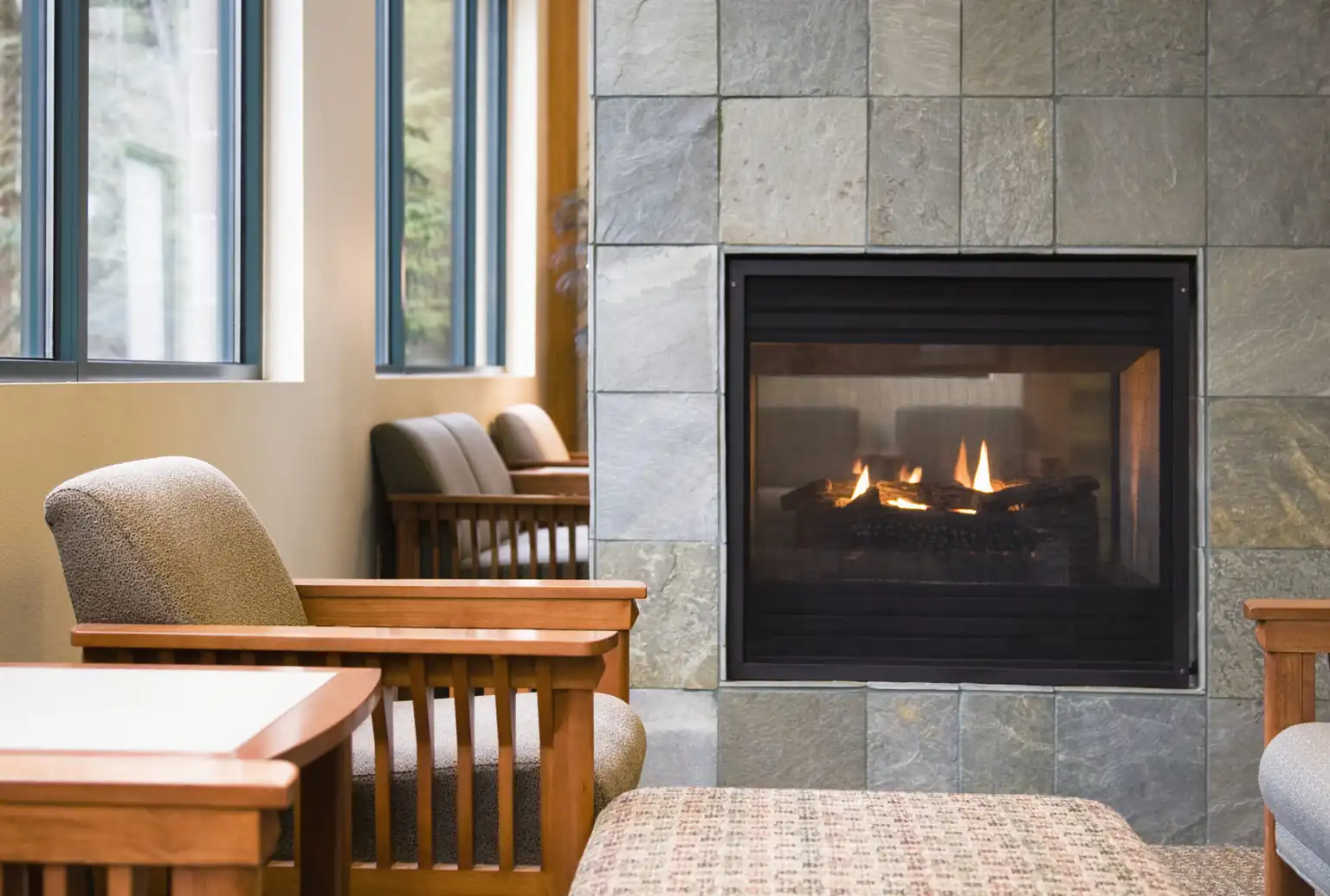 Indoor gas fireplace ready for fall maintenance and repair service in a coastal Bandon home.