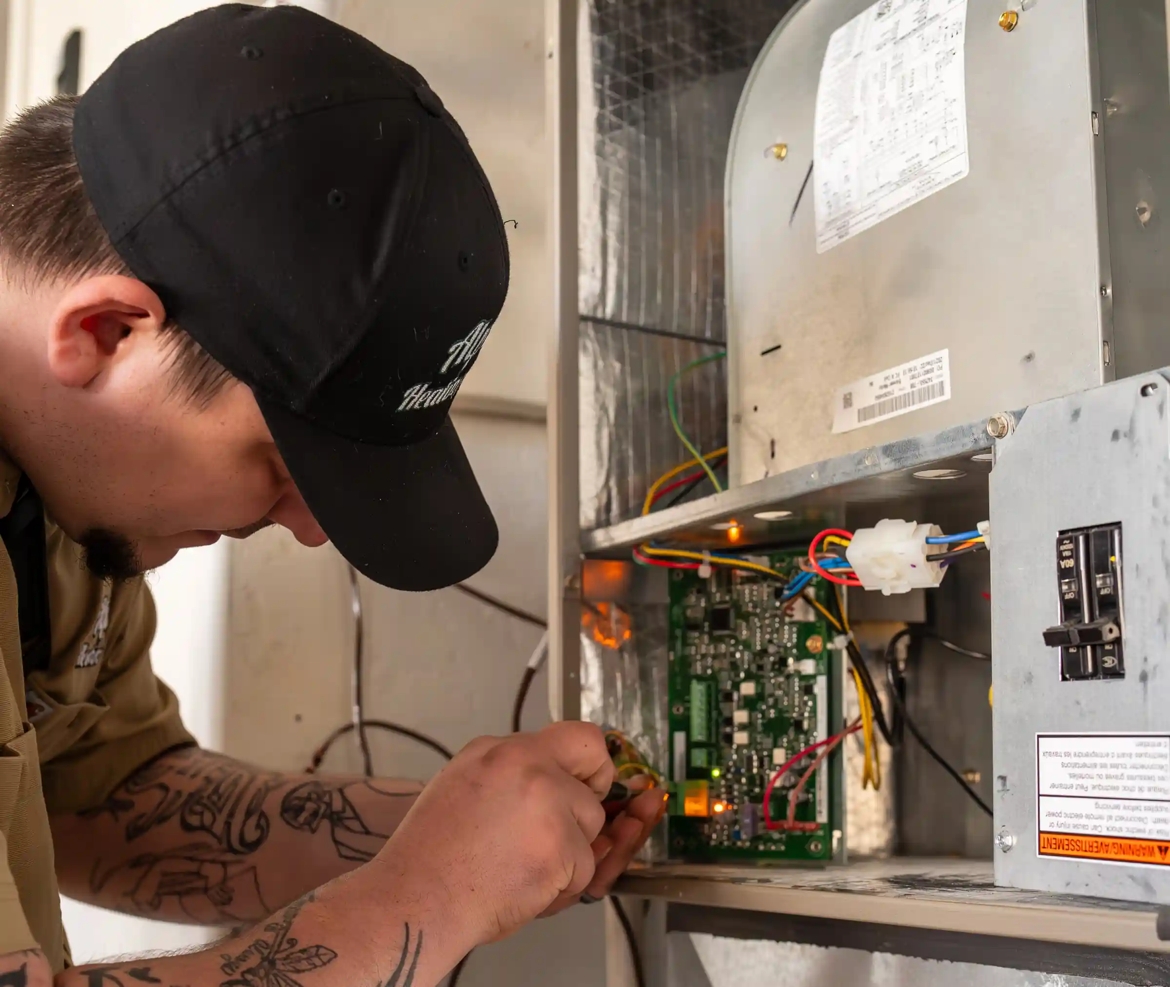 Technician diagnosing furnace components during a Bandon heating repair service.