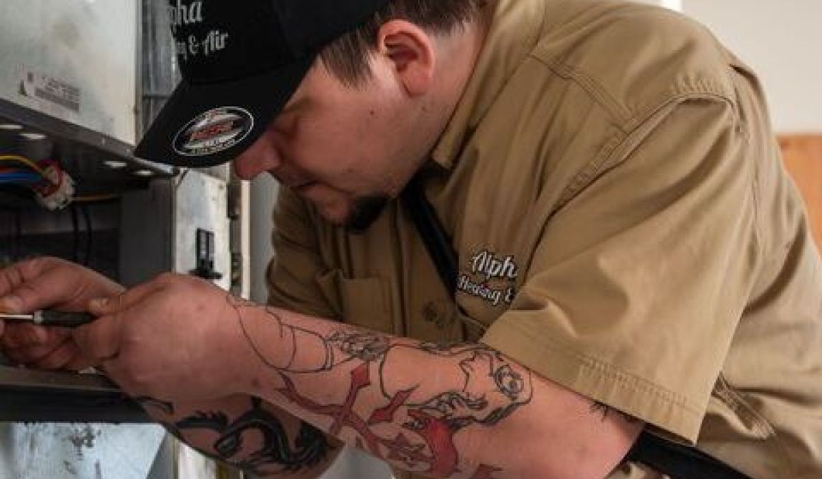 Image of a wrench tightening a leaking faucet